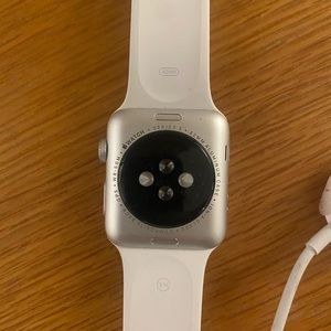 White Apple Watch with charger